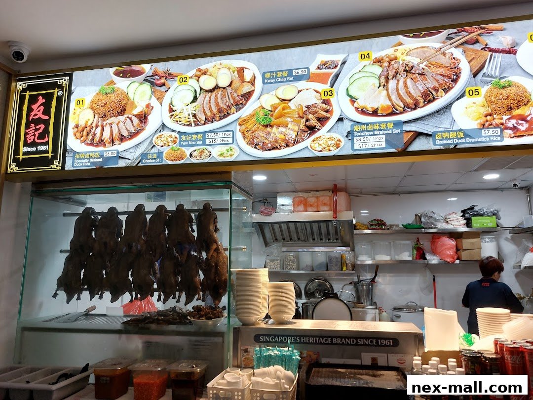 A food stall menu displaying various braised duck dishes and sets with prices.