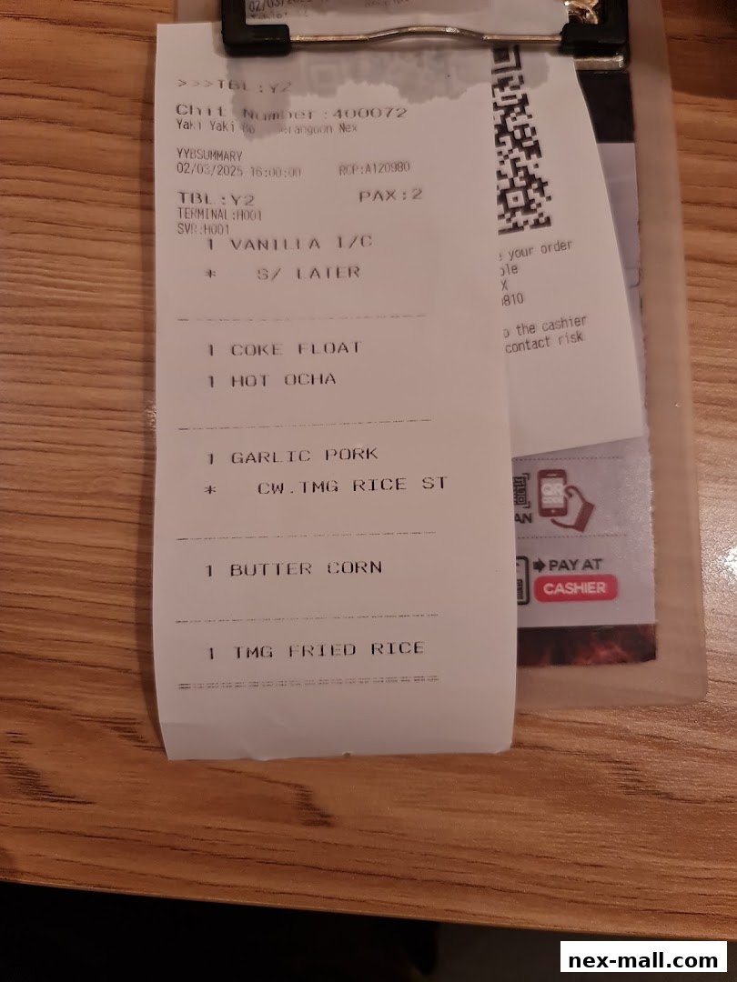 A receipt from Yaki Yaki Bo NEX listing food and drink orders.