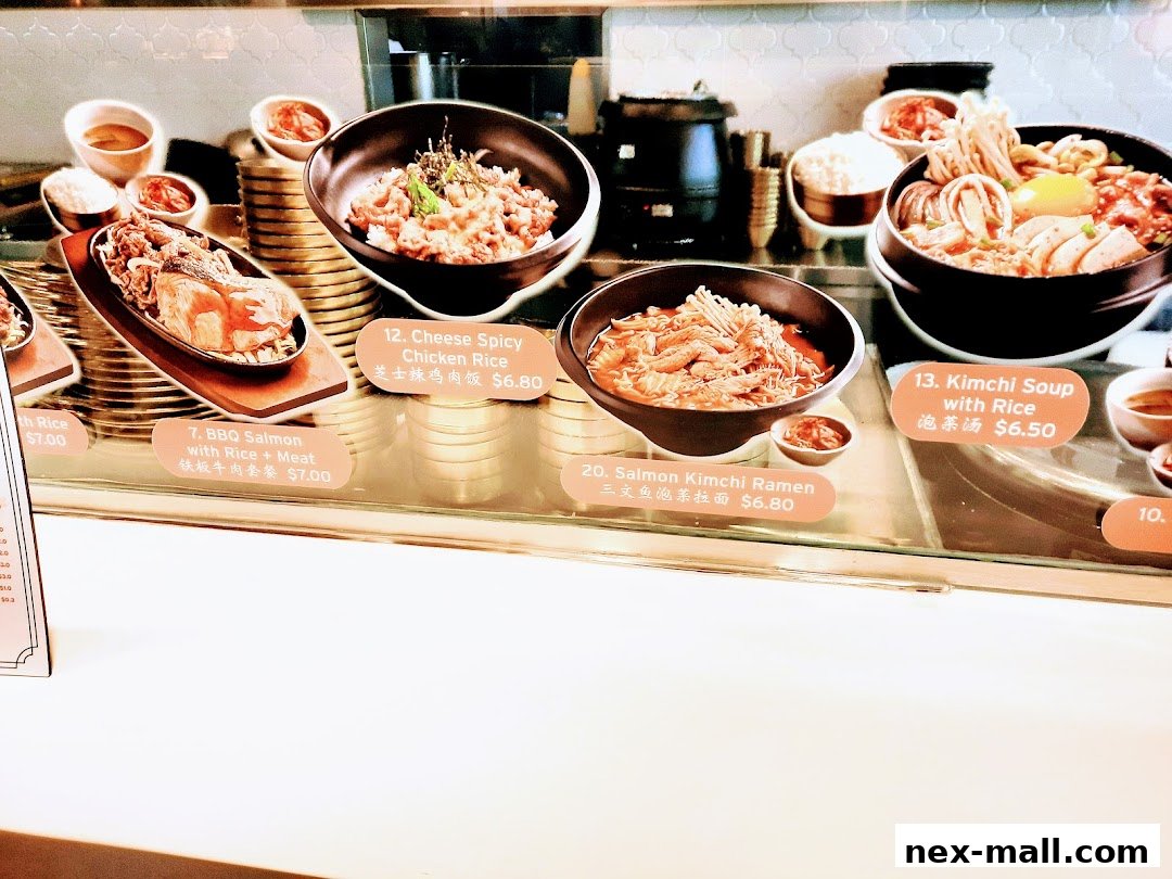 A display of various Korean dishes with their names and prices.