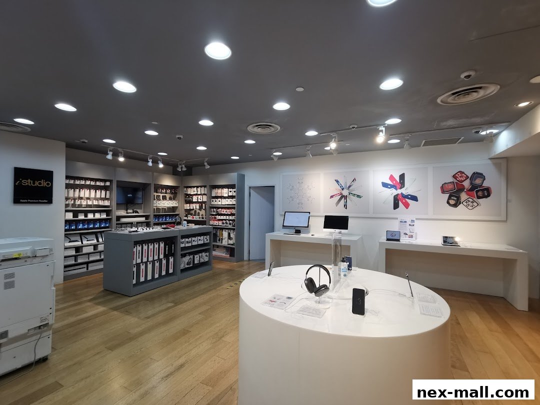 Interior view of an iStudio Apple Premium Reseller store showcasing Apple products and accessories.