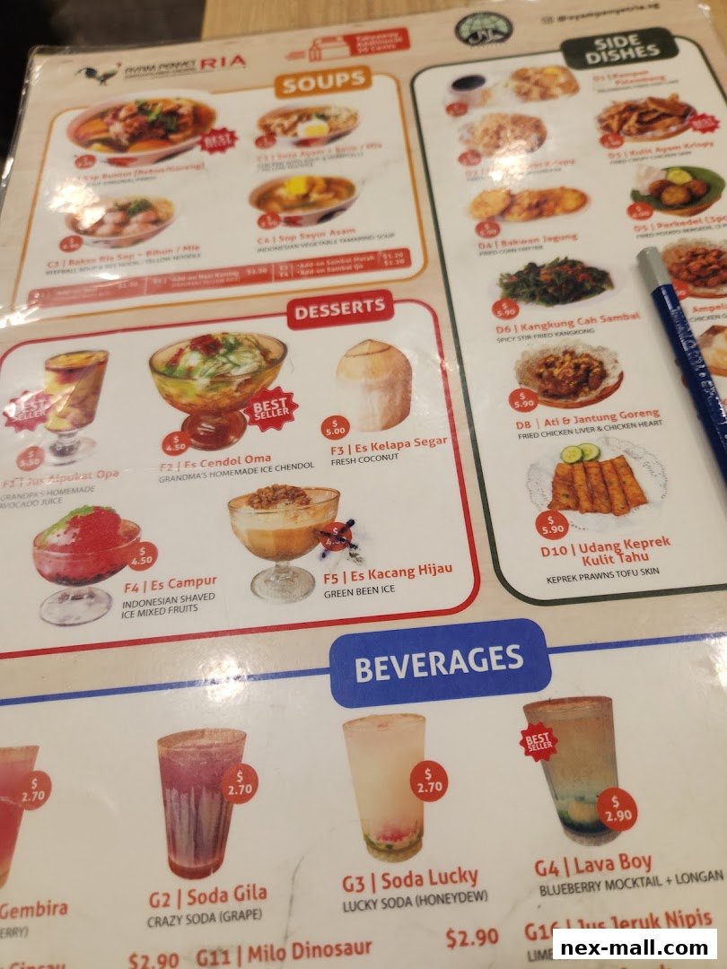 A menu from Ayam Penyet Ria featuring soups, side dishes, desserts, and beverages.