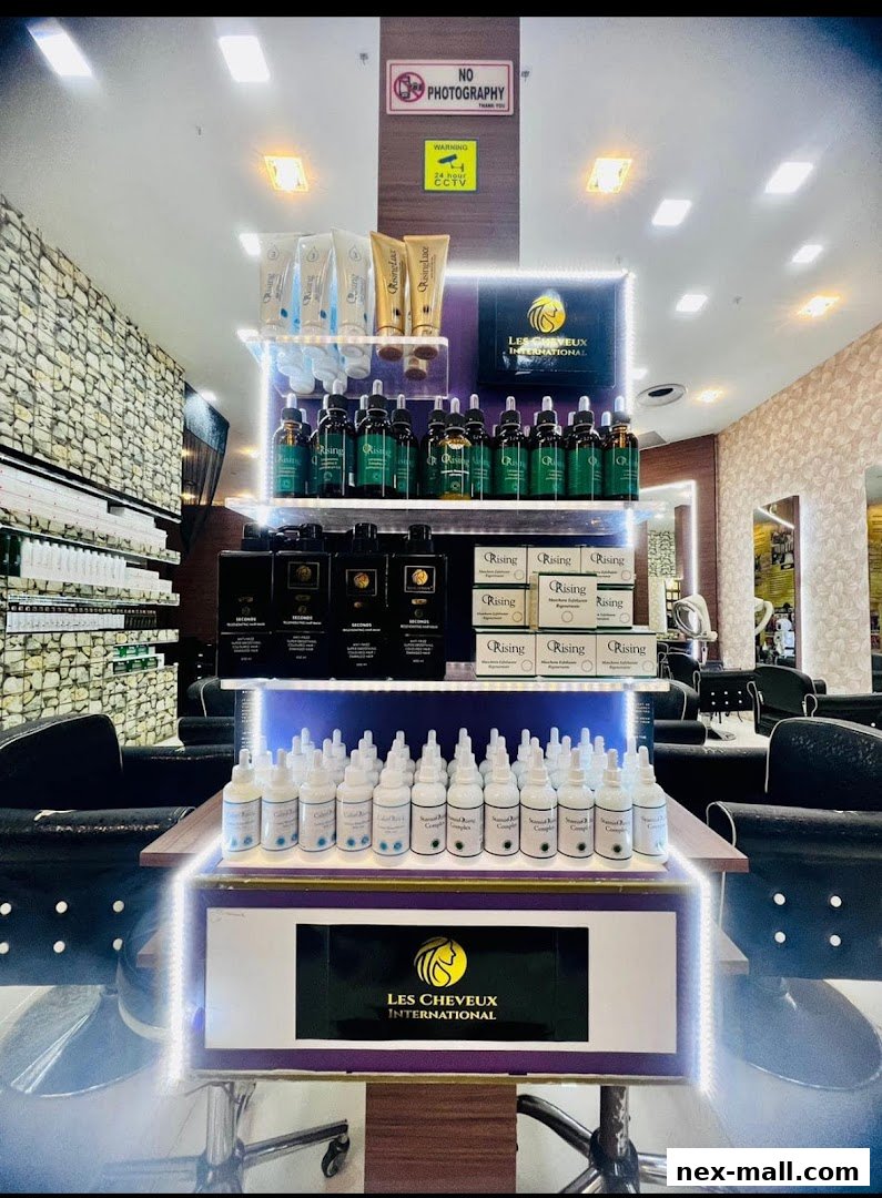 A display of hair care products from Les Cheveux International, featuring bottles and tubes.
