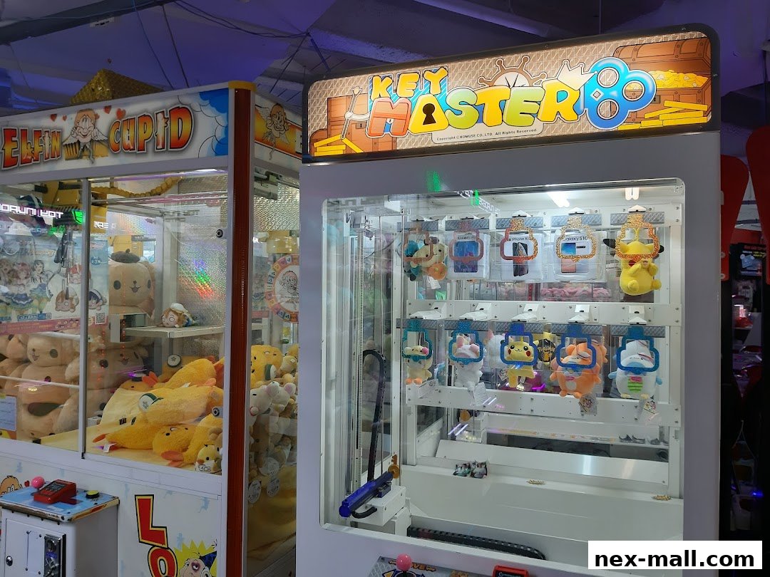 Two arcade claw machines, one labeled 'Elfin Cupid' and the other 'Key Master 8'.