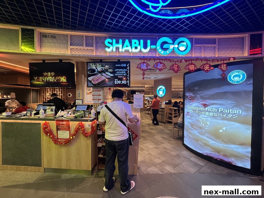 The entrance of SHABU-GO, a Japanese hotpot restaurant, with a promotional display.
