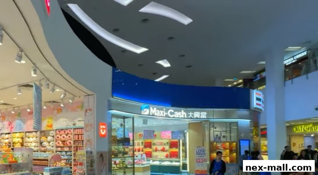 The entrance of Maxi-Cash NEX Serangoon shop with various products displayed inside.
