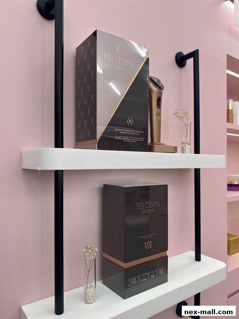Shelves display Telosin anti-aging devices and skincare products in elegant packaging.
