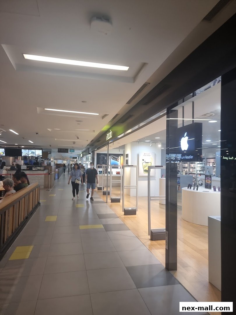 The exterior of an iStudio Apple Premium Reseller shop with an Apple logo visible.