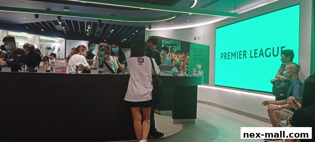 Customers are seen at the StarHub Nex store, with a large screen displaying 'PREMIER LEAGUE'.