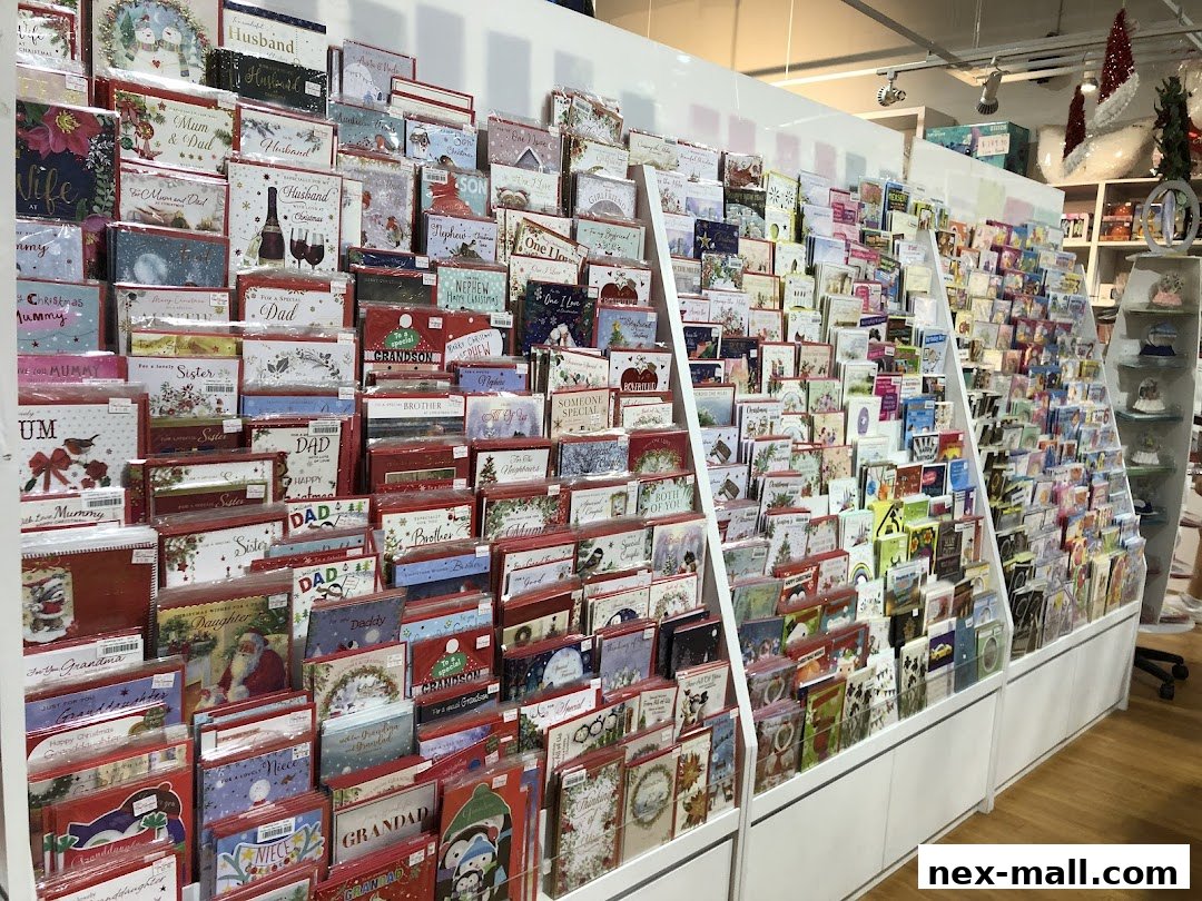 A wide selection of greeting cards displayed on tiered shelving in a retail store.