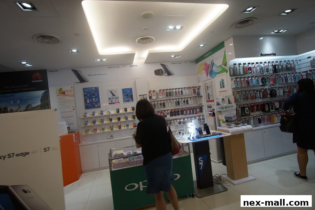 Interior of a modern phone shop displaying various mobile phones and accessories.