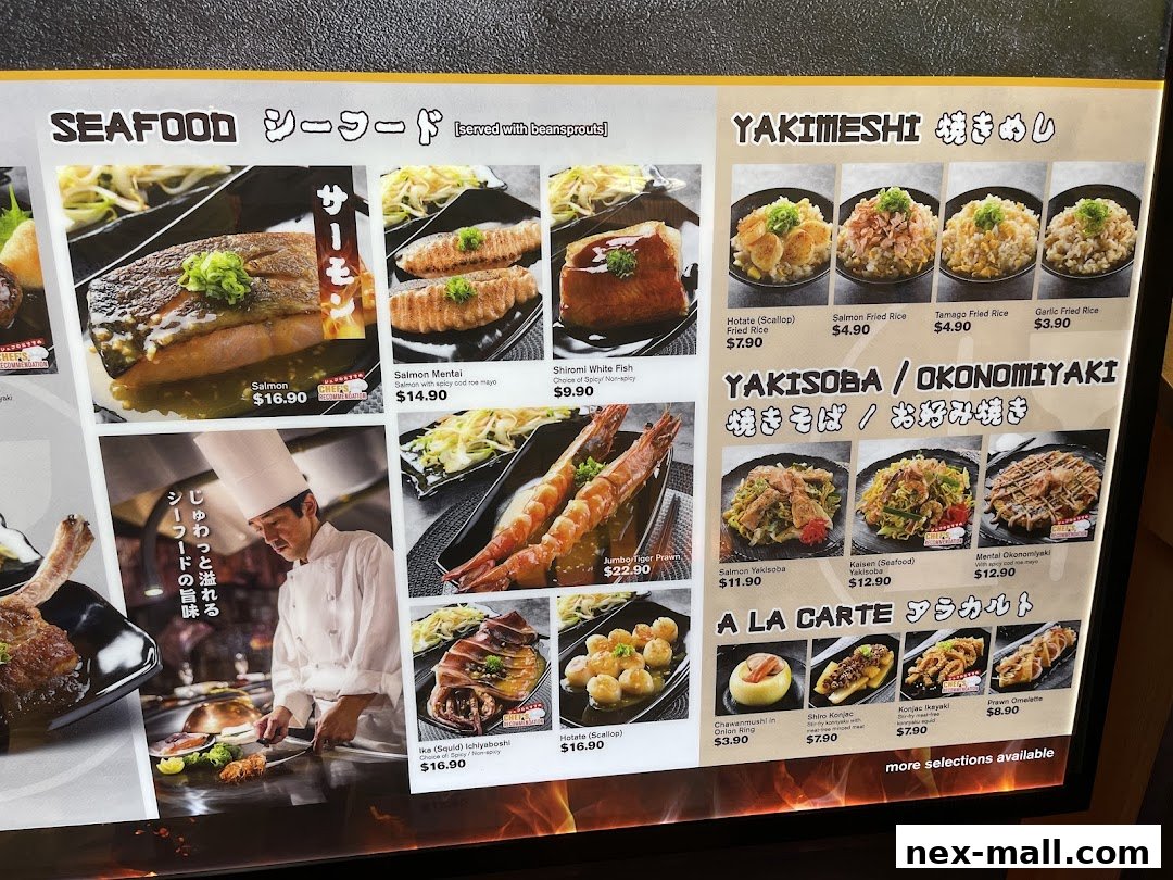 A menu board displaying various Japanese seafood, yakimeshi, yakisoba, and okonomiyaki dishes with prices.