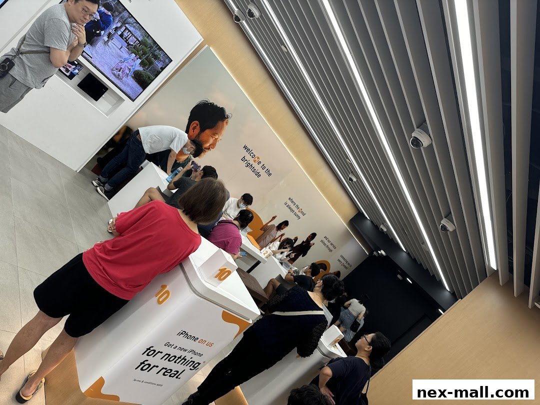 Customers are browsing in a brightly lit phone shop with promotional displays.