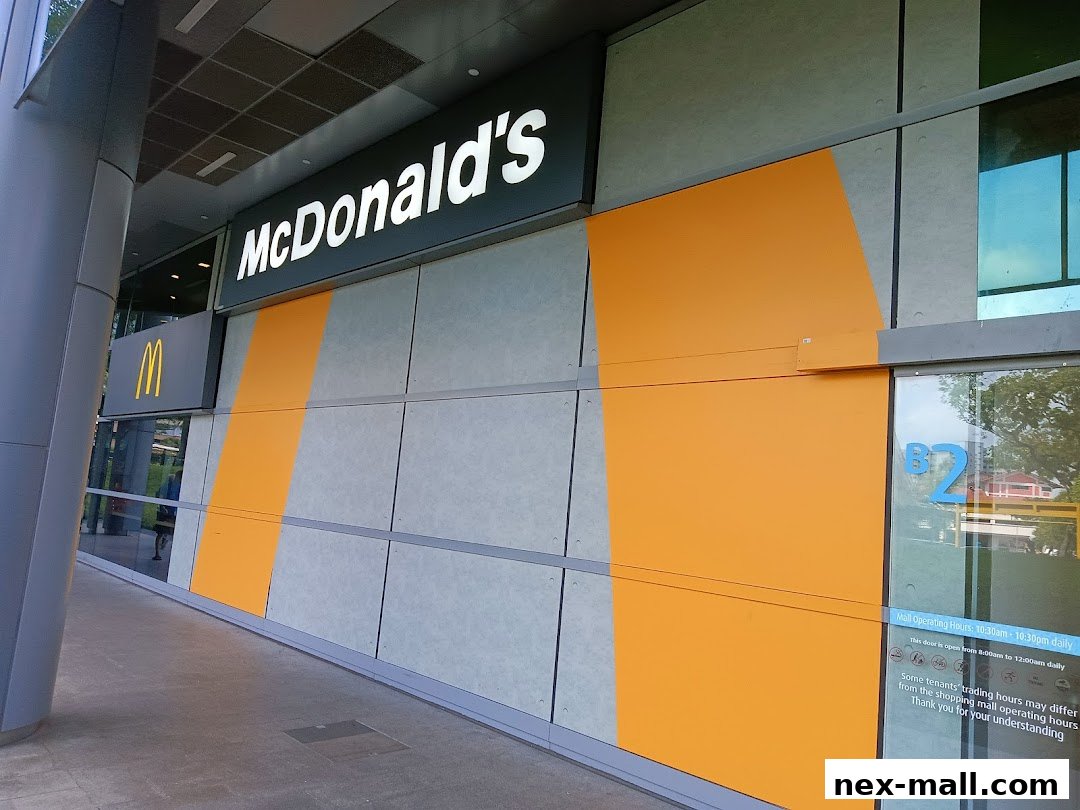 The exterior of a McDonald's restaurant with its iconic logo and orange accents.