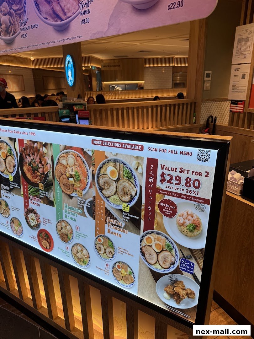 A brightly lit menu board showcasing various ramen dishes and a value set.