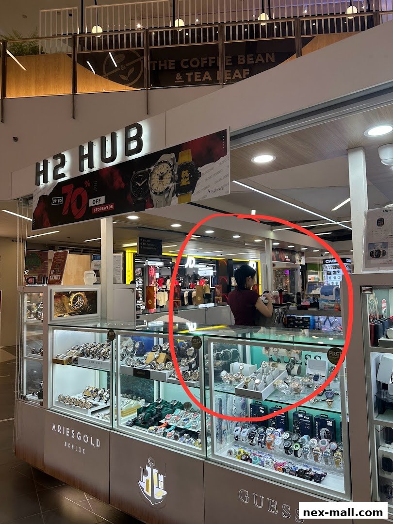 A H2 Hub watch store with a wide selection of timepieces displayed in glass cases.