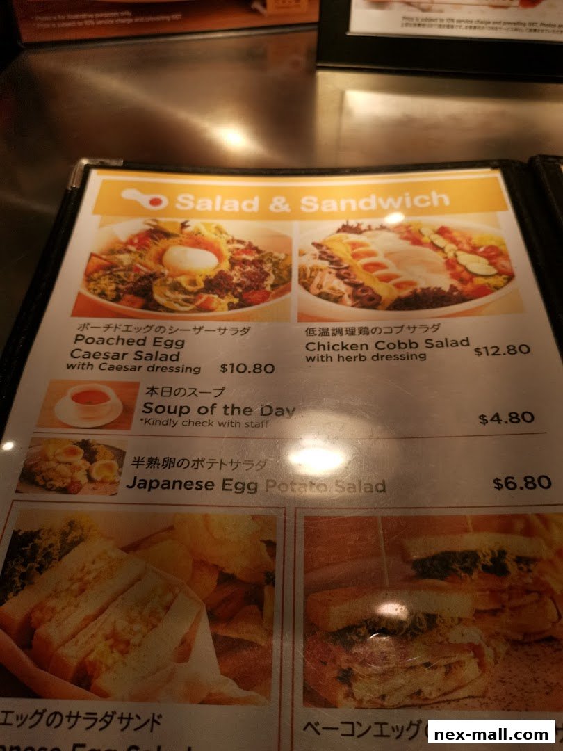 A menu featuring salads, sandwiches, and soup with appetizing food photography.
