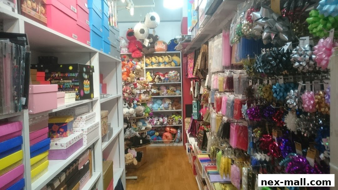 Interior view of a gift shop with shelves stocked with gift boxes, plush toys, and decorative bows.