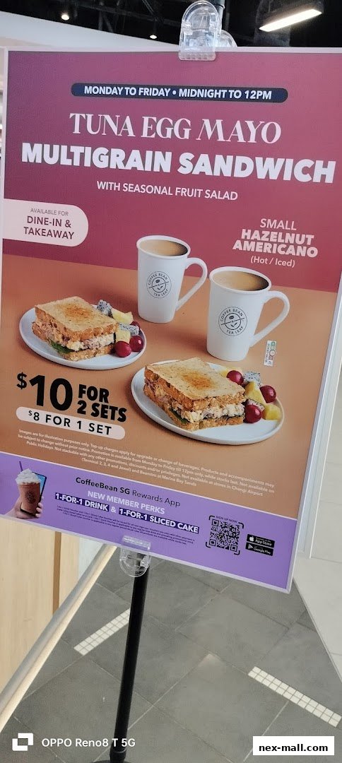 A promotional poster for The Coffee Bean & Tea Leaf featuring a sandwich and coffee deal.