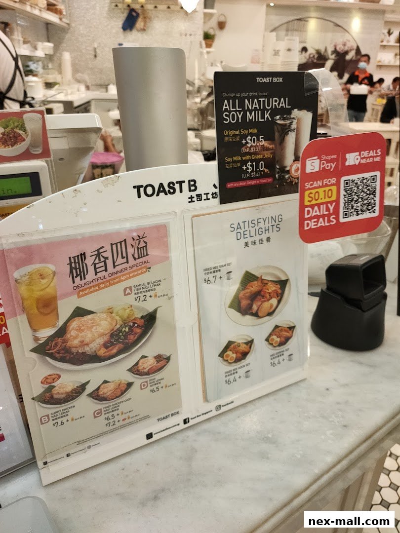 A display of Toast Box menu items including dinner specials and soy milk drinks.