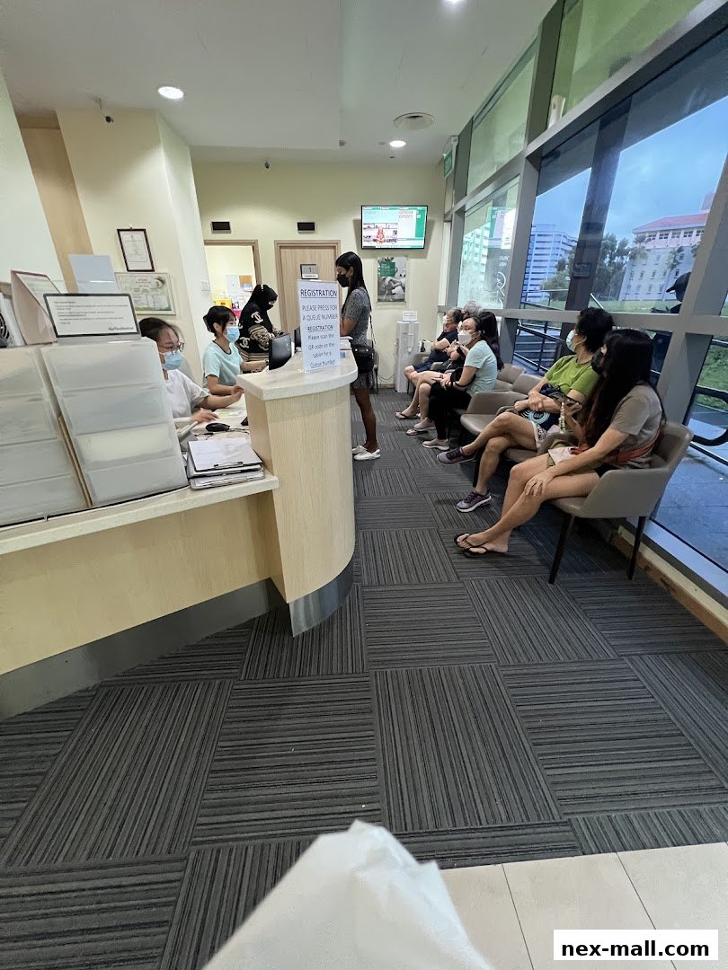 Patients waiting at the reception desk of Raffles Medical clinic.