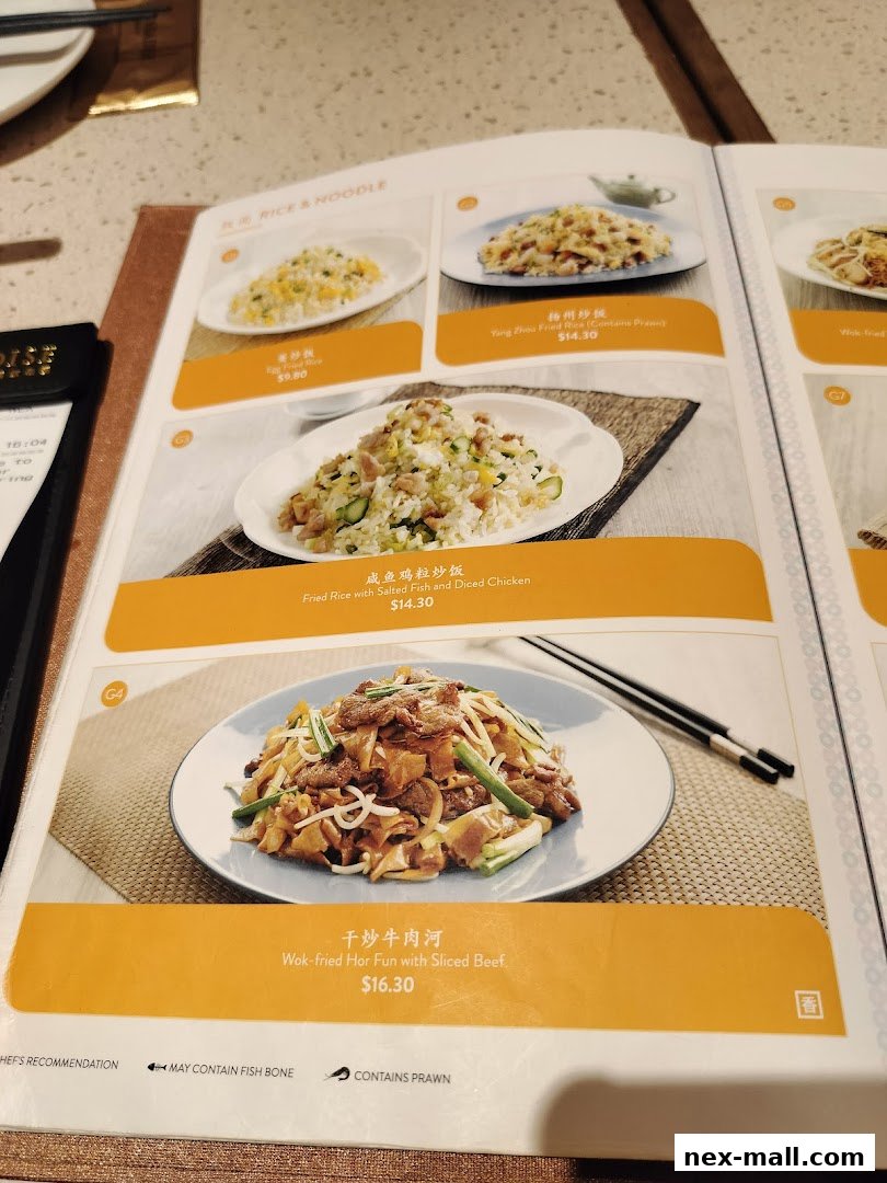 A menu from Canton Paradise showcasing various rice and noodle dishes with prices.