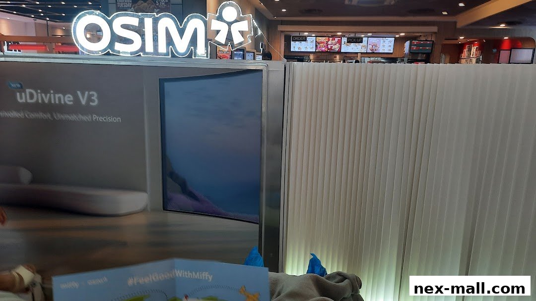 The OSIM Nex shop features a prominent illuminated logo and a display for the new uDivine V3 massage chair.