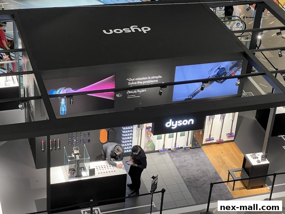 An overhead view of a modern Dyson store showcasing vacuum cleaners and hair dryers.