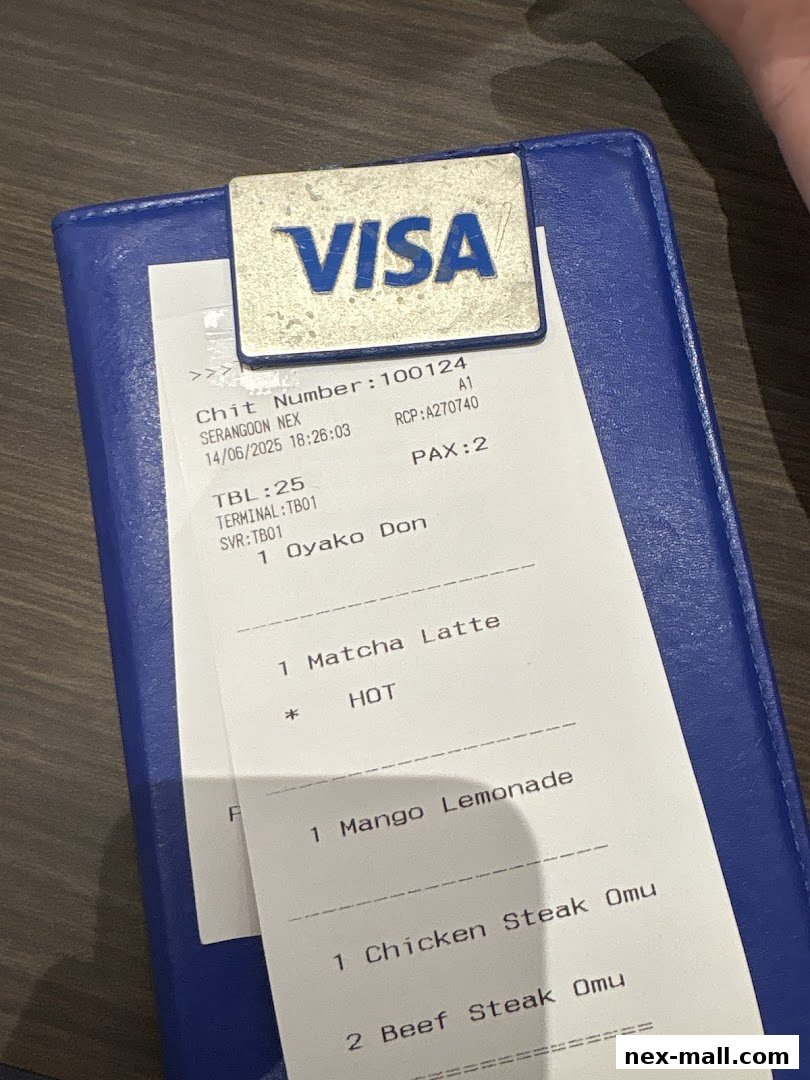 A receipt from Tamago-EN NEX showing food and drink orders.