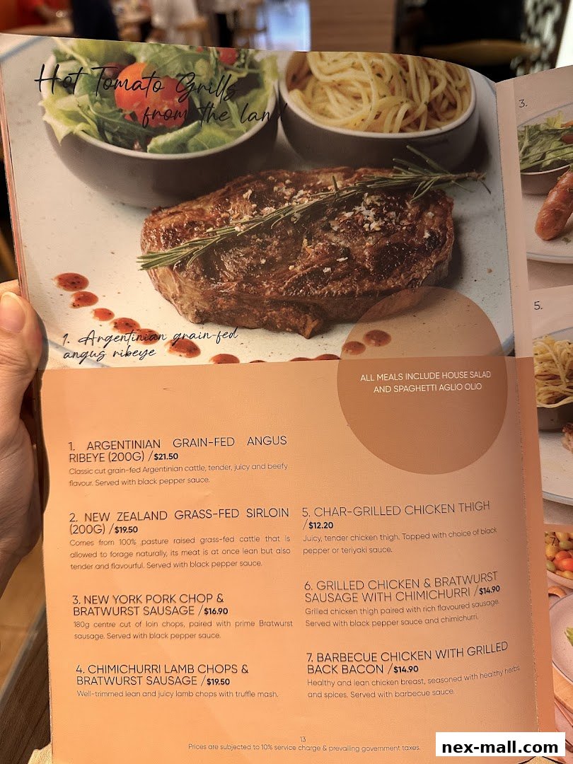 A menu from Hot Tomato featuring grilled meats like Argentinian ribeye and lamb chops.