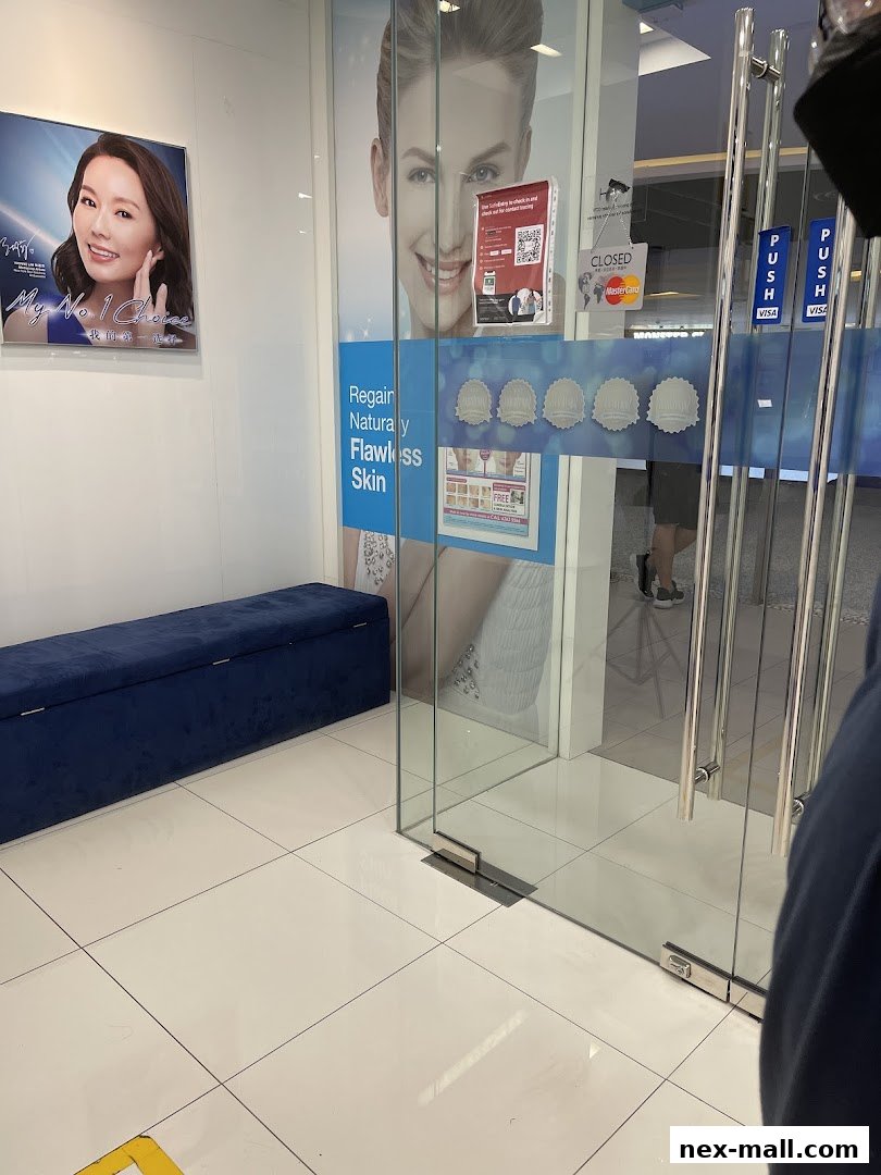 The entrance to New York Skin Solutions, featuring a poster and glass doors with branding.