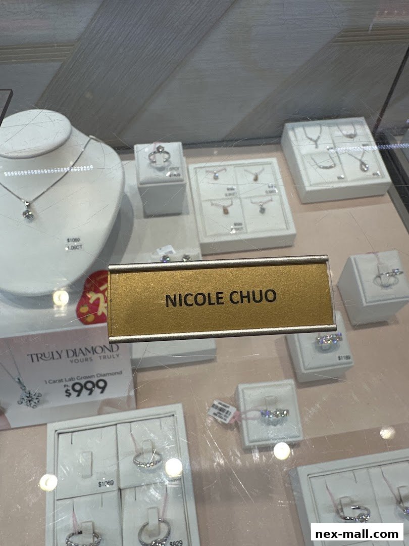 A display case filled with various diamond jewelry, including necklaces and rings.