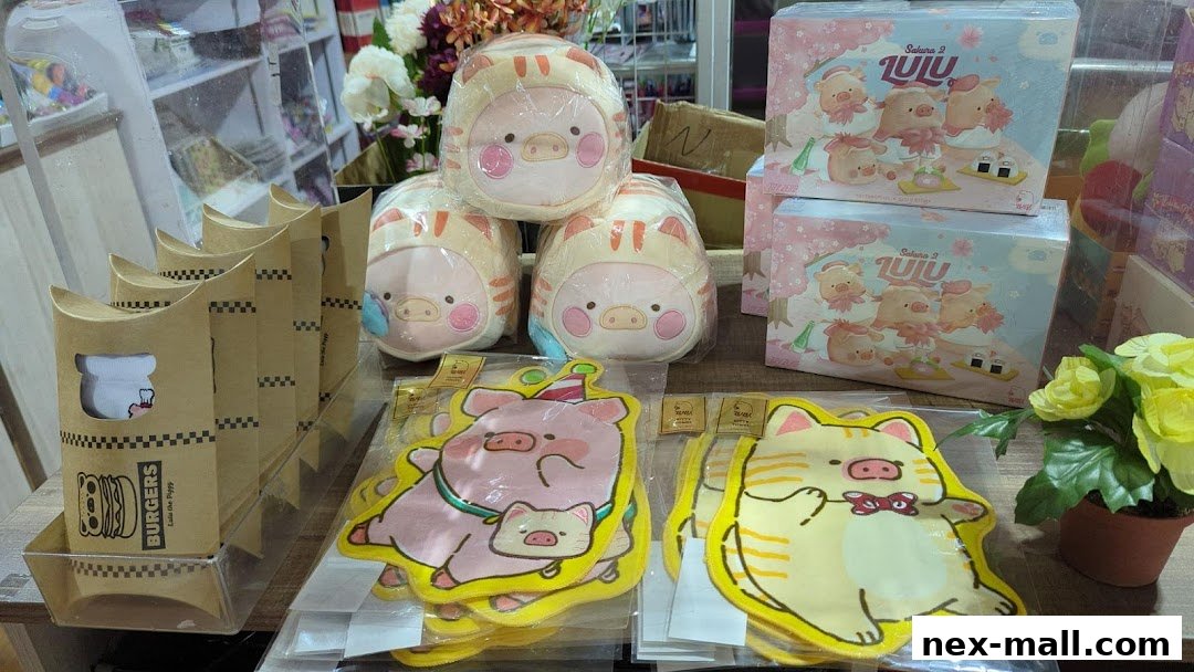 Cute pig and cat themed plush toys and stationery items displayed in a shop.