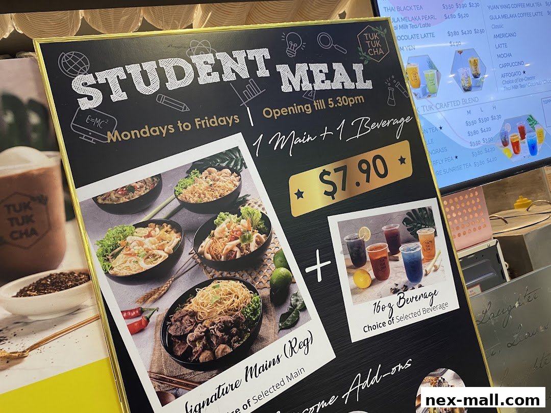 A menu board for Tuk Tuk Cha's Student Meal deal, featuring main dishes and beverages.
