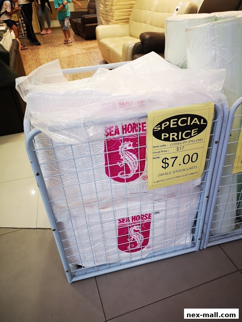Sea Horse branded pillows displayed in a retail store with a special price tag.
