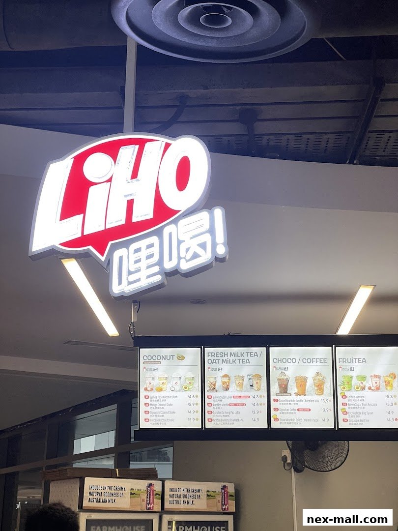 A brightly lit menu board for LiHO TEA showcasing various beverage categories and items.