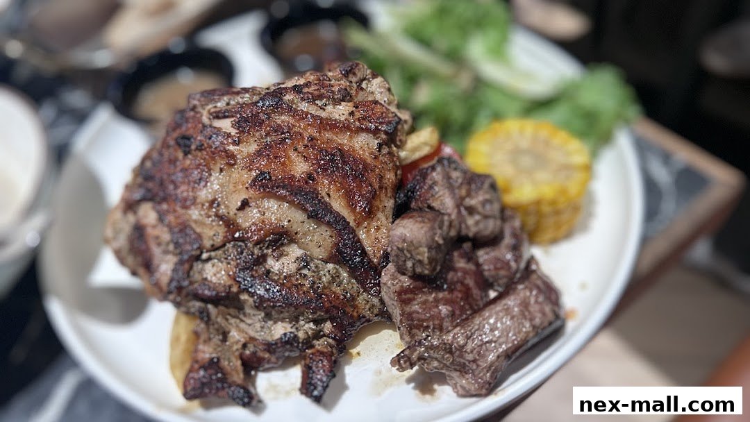 A plate of grilled meat, corn, and salad, served at COLLINS NEX.