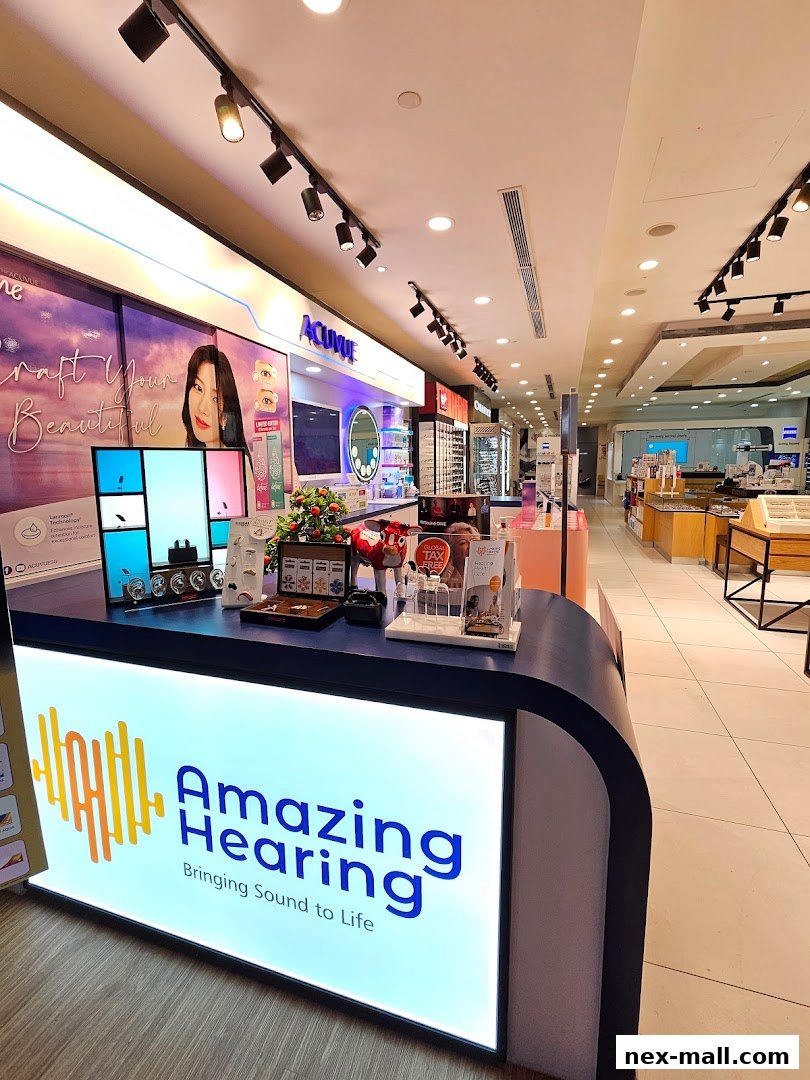 Interior view of an optical shop with displays of eyewear and a counter.