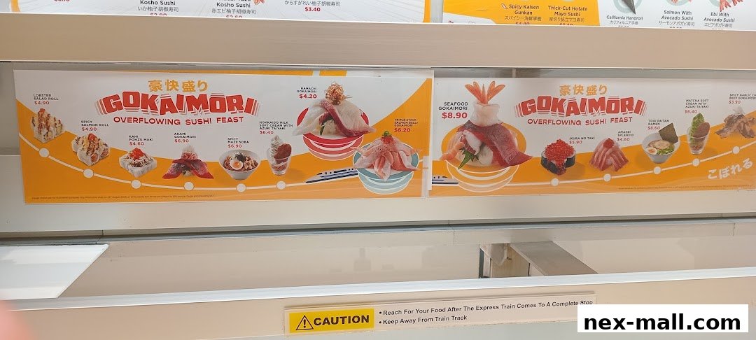 A display of various sushi dishes and other Japanese food items with prices.