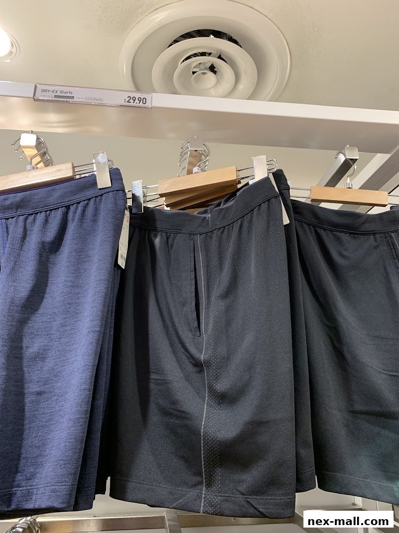 UNIQLO DRY-EX Shorts displayed on hangers with price tags.