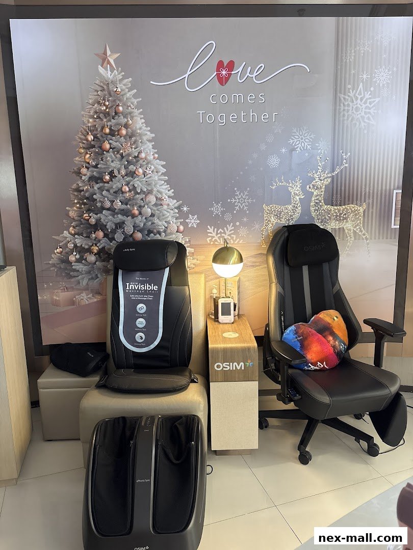 OSIM Nex shop interior featuring massage chairs, a foot massager, and festive holiday decor.