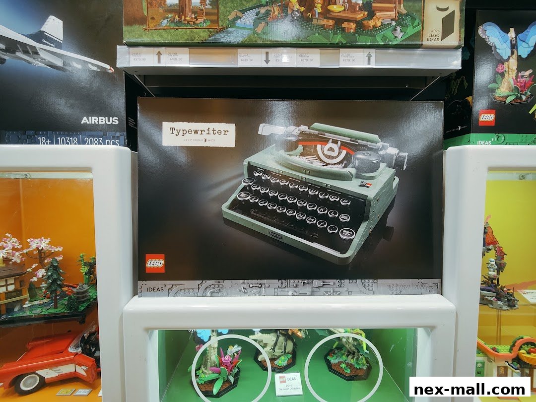 A display of LEGO sets, including a typewriter and an Airbus, in a retail store.