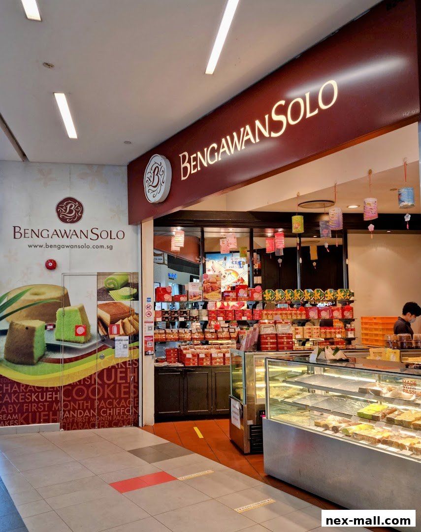 The exterior of Bengawan Solo, a shop selling cakes and cookies, with a display of products inside.