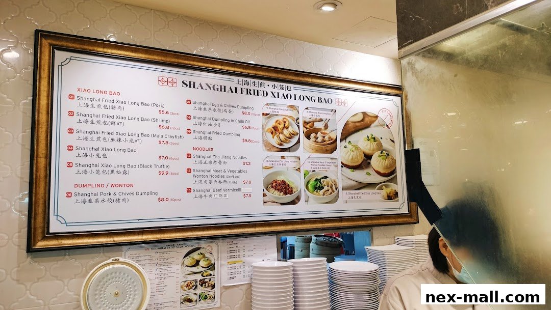 A menu board displaying various Shanghai fried dumplings and noodles with prices.