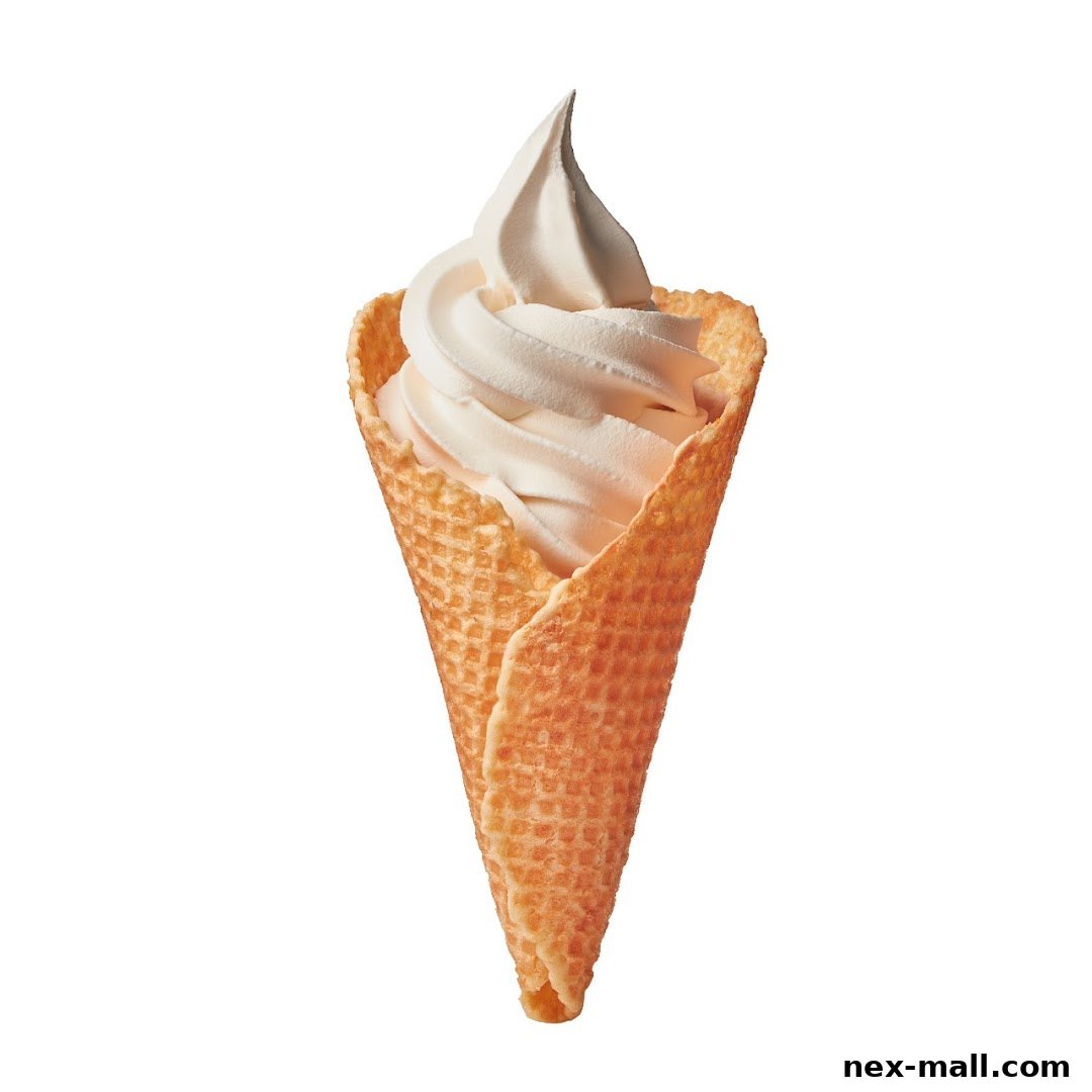 A close-up shot of a creamy soft-serve ice cream in a waffle cone.