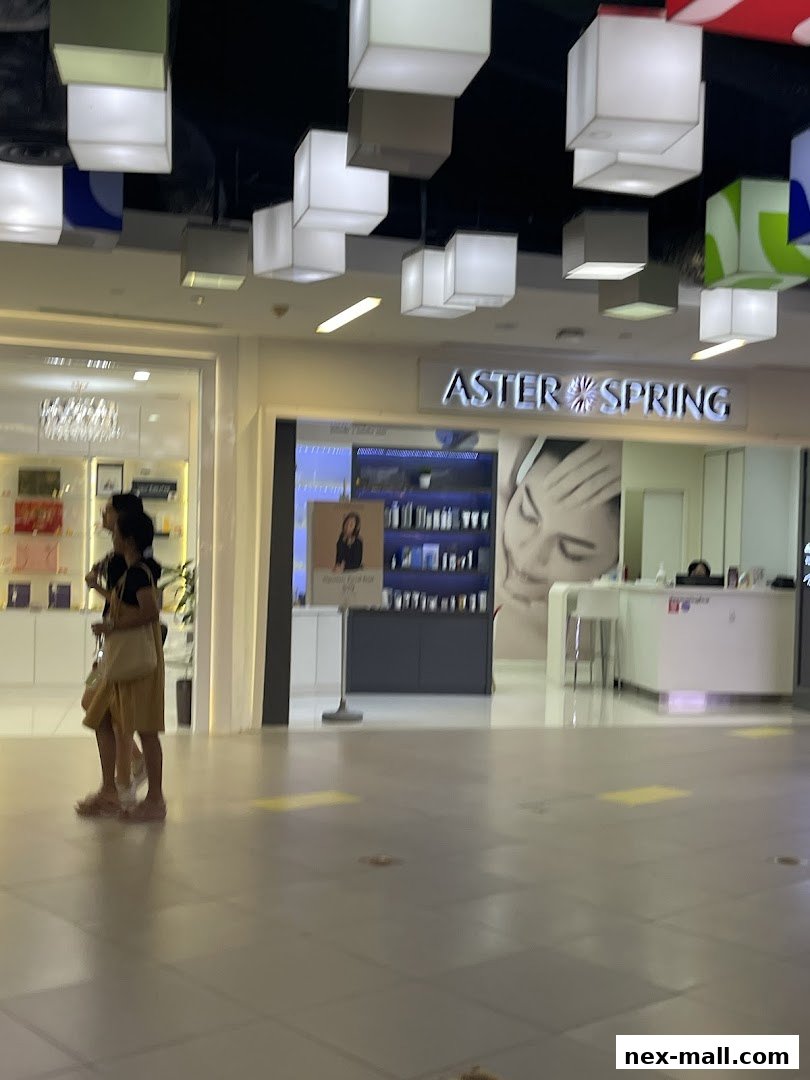 The exterior of the AsterSpring beauty salon with its prominent signage and display.