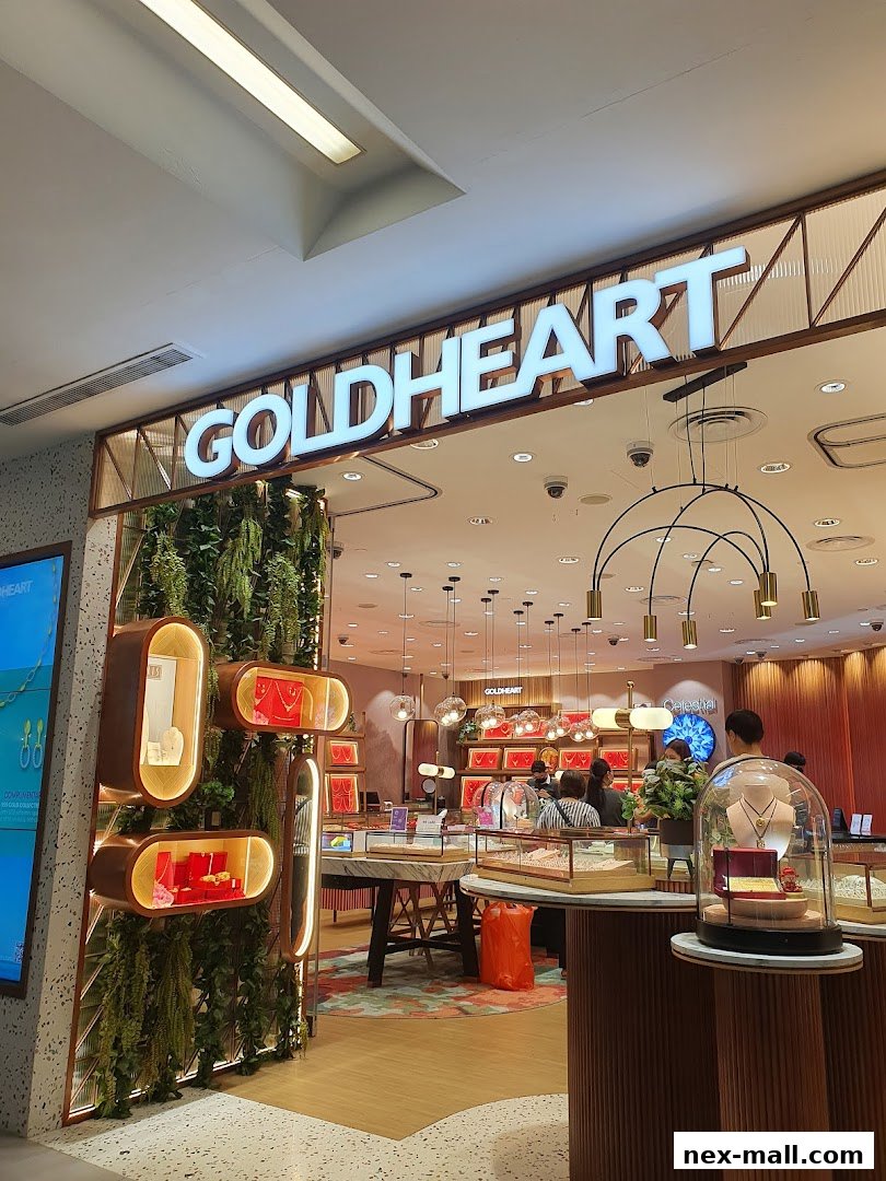 The entrance of a Goldheart Jewelry store with displays of necklaces and jewelry.
