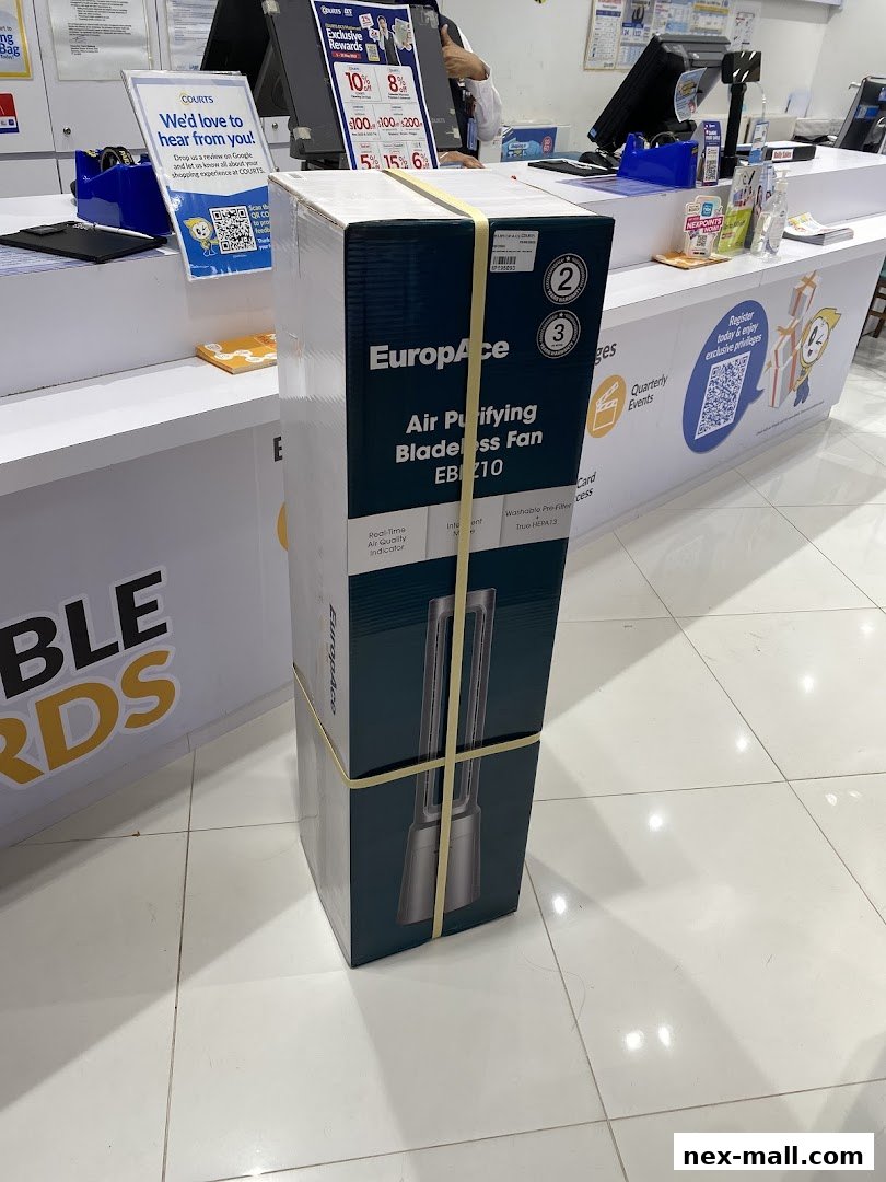 A boxed EuropAce bladeless fan is displayed at the COURTS store counter.