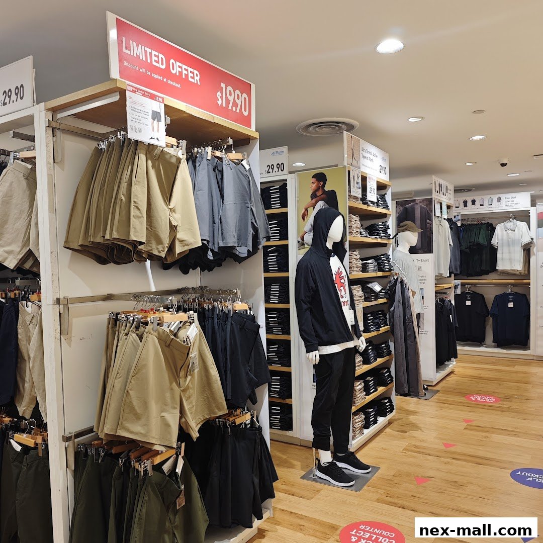 Interior view of a UNIQLO store showcasing clothing displays and mannequins.