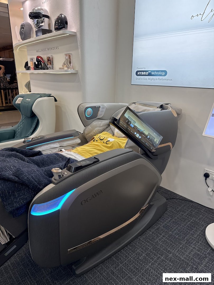 OGAWA massage chair with a person relaxing, showcasing advanced technology and wellness products.