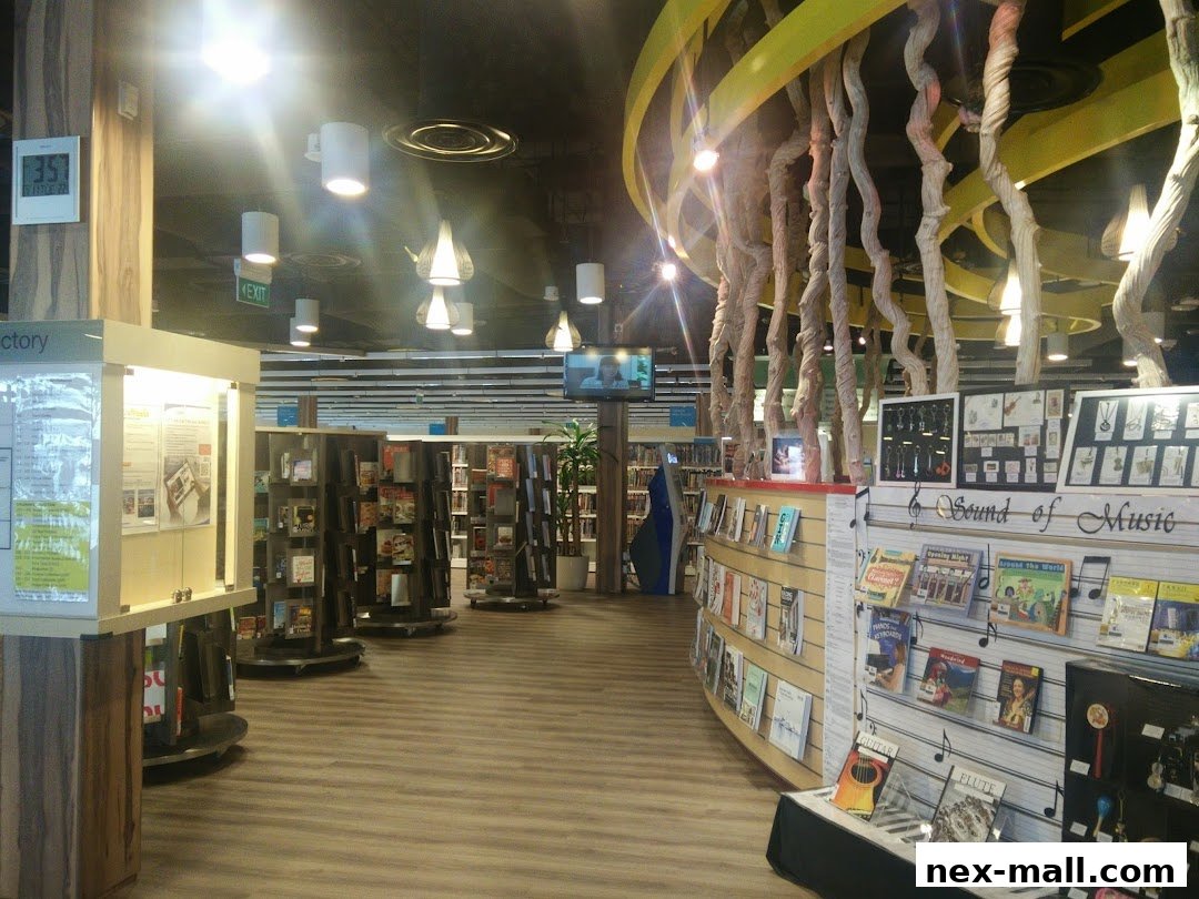 Interior view of a library with bookshelves, displays, and unique decorative elements.